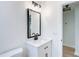 Modern bathroom with white vanity and black fixtures at 1751 28Th S St, St Petersburg, FL 33712