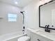 Updated bathroom with white subway tile and modern vanity at 1751 28Th S St, St Petersburg, FL 33712