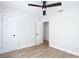 Spacious bedroom with wood-look floors and access to other rooms at 1751 28Th S St, St Petersburg, FL 33712