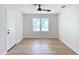 Bright bedroom with new flooring and ceiling fan at 1751 28Th S St, St Petersburg, FL 33712