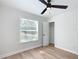 Well-lit bedroom with a large window, ceiling fan and closet at 1751 28Th S St, St Petersburg, FL 33712
