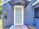 Detailed view of the front door of the blue house at 1751 28Th S St, St Petersburg, FL 33712