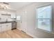Modern kitchen with white cabinets, black appliances, and granite countertops at 1751 28Th S St, St Petersburg, FL 33712