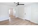 Living room with wood-look floors and access to other rooms at 1751 28Th S St, St Petersburg, FL 33712