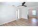 Living room with wood-look floors and archway to dining area at 1751 28Th S St, St Petersburg, FL 33712