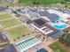 Aerial view of community center with amenities including pool, lawn bowling, and shuffleboard at 809 Chipper Dr, Sun City Center, FL 33573