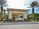 Club Renaissance entrance with porte-cochere, well-maintained landscaping, and elegant signage at 809 Chipper Dr, Sun City Center, FL 33573