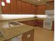This kitchen features granite countertops, stainless steel appliances, and plenty of storage space for all your cooking needs at 809 Chipper Dr, Sun City Center, FL 33573