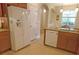This kitchen features stainless steel appliances, granite countertops, and an island for food preparation and serving at 809 Chipper Dr, Sun City Center, FL 33573