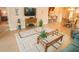 This living room features comfortable seating, a decorative rug, and a large window, creating a cozy and inviting space at 809 Chipper Dr, Sun City Center, FL 33573