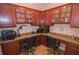 This cozy office features built-in wooden cabinets and granite counters offering an ideal workspace for focus and creativity at 809 Chipper Dr, Sun City Center, FL 33573