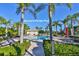 Verona's private pool is surrounded by lush landscaping, lounge chairs, and patio tables, offering a relaxing outdoor oasis at 809 Chipper Dr, Sun City Center, FL 33573