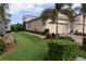 Well-maintained house with a two-car garage and landscaped front yard at 809 Chipper Dr, Sun City Center, FL 33573