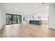 Spacious living area with hardwood floors and sliding glass doors at 19411 Sheltered Hill Dr, Brooksville, FL 34601