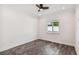 Spacious bedroom with wood-look tile floors and window at 865 N Shore Dr, Anna Maria, FL 34216