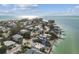 Aerial view of home in beach community at 865 N Shore Dr, Anna Maria, FL 34216