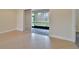 Bedroom with tile floors and sliding glass doors to patio at 16216 Amethyst Key Dr, Wimauma, FL 33598