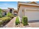 House exterior showcasing a well-maintained walkway and landscaping at 16216 Amethyst Key Dr, Wimauma, FL 33598