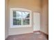 White front door with a brick pathway and side window at 16216 Amethyst Key Dr, Wimauma, FL 33598