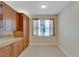 Bright kitchen boasts granite countertops and ample wood cabinetry at 16216 Amethyst Key Dr, Wimauma, FL 33598