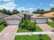 Two-story house with a large backyard and two car garage at 16216 Amethyst Key Dr, Wimauma, FL 33598