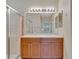 Double vanity bathroom with a walk-in shower and updated fixtures at 16216 Amethyst Key Dr, Wimauma, FL 33598