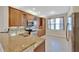 Kitchen features granite countertops and wood cabinets at 16216 Amethyst Key Dr, Wimauma, FL 33598