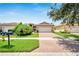 Single-Gathering home with a two-car garage and manicured lawn at 16216 Amethyst Key Dr, Wimauma, FL 33598
