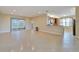 Open living room and kitchen area with tile floors at 16216 Amethyst Key Dr, Wimauma, FL 33598