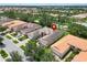 Aerial view showcasing a house's location within a community at 16216 Amethyst Key Dr, Wimauma, FL 33598