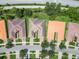 Aerial view of three homes in a residential community at 16216 Amethyst Key Dr, Wimauma, FL 33598