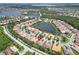 Aerial view showing a house's location near a lake at 16216 Amethyst Key Dr, Wimauma, FL 33598