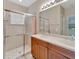 Bathroom with double vanity and walk-in shower at 16216 Amethyst Key Dr, Wimauma, FL 33598