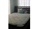Well-lit bedroom with a double bed and wooden frame at 2905 W Cherry St, Tampa, FL 33607