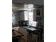 Kitchen with white cabinets and gas range at 2905 W Cherry St, Tampa, FL 33607