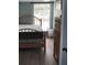 Bedroom with a full-size bed, dresser, and window at 2905 W Cherry St, Tampa, FL 33607
