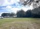Expansive front lawn with beautiful trees and ample space for various outdoor activities at 30737 Elam Rd, Wesley Chapel, FL 33545