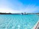 Crystal-clear lagoon pool with water features at 16632 Goose Ribbon Pl, Wimauma, FL 33598