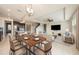 Bright dining area features a modern table, setting a welcoming mood at 16632 Goose Ribbon Pl, Wimauma, FL 33598