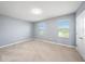 Spacious bedroom with neutral walls and carpet at 16632 Goose Ribbon Pl, Wimauma, FL 33598