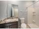 Clean bathroom with granite vanity and shower at 16632 Goose Ribbon Pl, Wimauma, FL 33598