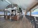 Indoor bar with wooden deck and seating at 16632 Goose Ribbon Pl, Wimauma, FL 33598