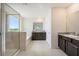 Primary bathroom with soaking tub and double vanity at 16632 Goose Ribbon Pl, Wimauma, FL 33598