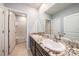 Bathroom with double vanity and granite countertop at 16632 Goose Ribbon Pl, Wimauma, FL 33598