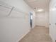 Large walk in closet with neutral carpet at 16632 Goose Ribbon Pl, Wimauma, FL 33598