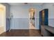 Home office with view into kitchen and ample natural light at 16632 Goose Ribbon Pl, Wimauma, FL 33598