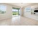 Bright dining room with sliding doors leading to patio at 16632 Goose Ribbon Pl, Wimauma, FL 33598