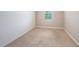 Empty bedroom with neutral walls and carpeted floor at 16632 Goose Ribbon Pl, Wimauma, FL 33598