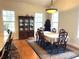 Formal dining room with hardwood floors and large windows at 30737 Elam Rd, Wesley Chapel, FL 33545