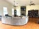 Large living room with stone fireplace and hardwood floors at 30737 Elam Rd, Wesley Chapel, FL 33545